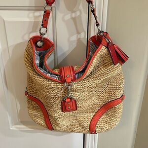 Coach straw with orange/red trim.